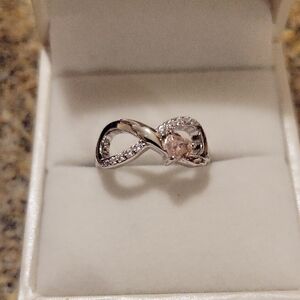 Elegant Silver Infinity Ring with Pink Accent